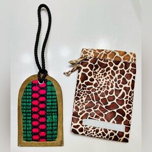 New, tags attached, travel/suitcase tag with cover by Noonday Collection.